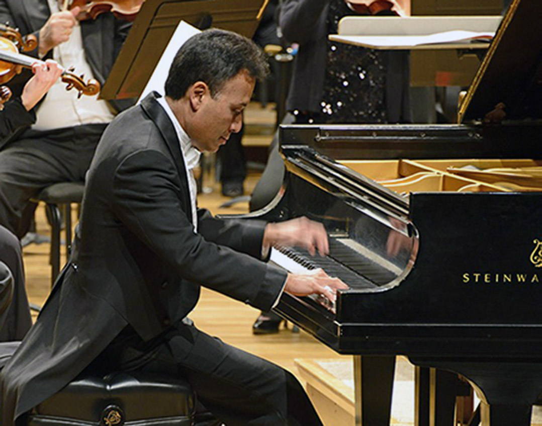 Pianist Jon Nakamatsu performing with orchestra.